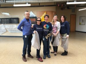 Five Green Team staff members, participating in a clean up.